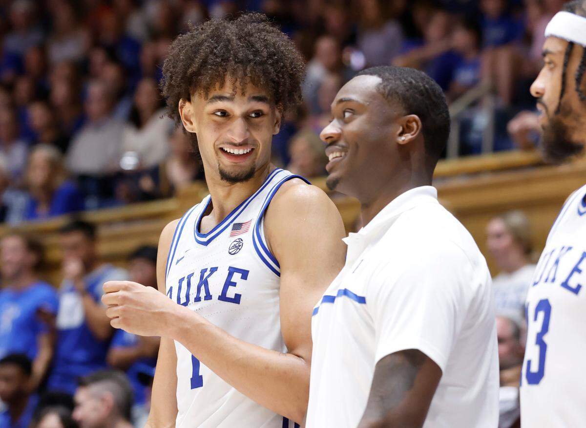 Duke’s Dereck Lively II (1) laughs while talking with Dariq Whitehead during the second half of Duke’s 84-38 victory over USC Upstate at Cameron Indoor Stadium in Durham, N.C., Friday, Nov. 11, 2022.