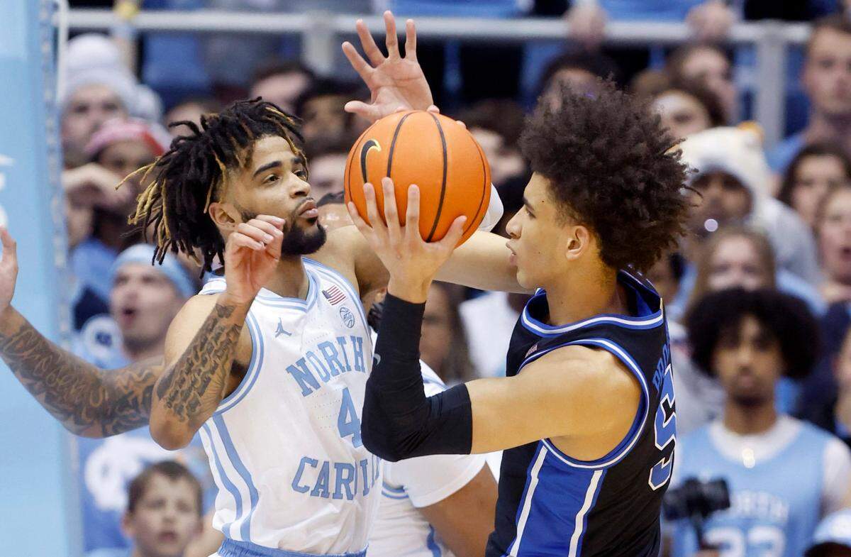 North Carolina’s RJ Davis (4) defends Duke’s Tyrese Proctor (5) during the first half of UNC’s game against Duke at the Smith Center in Chapel Hill, N.C., Saturday, March 4, 2023.