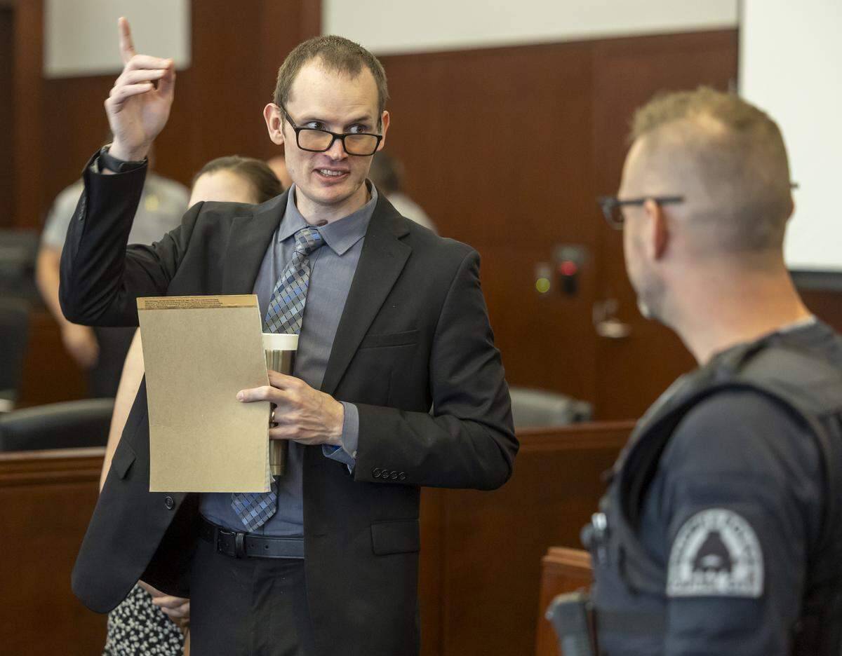 Former Raleigh Police officer C.D. Ainsworth talks with well wishers following his emotional testimony in court on Friday, September 12, 2025 in Raleigh, N.C.