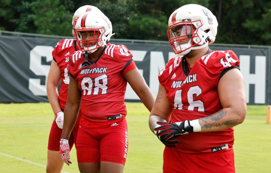 N.C. State defensive end Isaiah Shirley (88) and defensive lineman Nick Campbell (46) wait for a drill during the Wolfpack’s first fall practice in Raleigh, N.C., Wednesday, August 2, 2023.