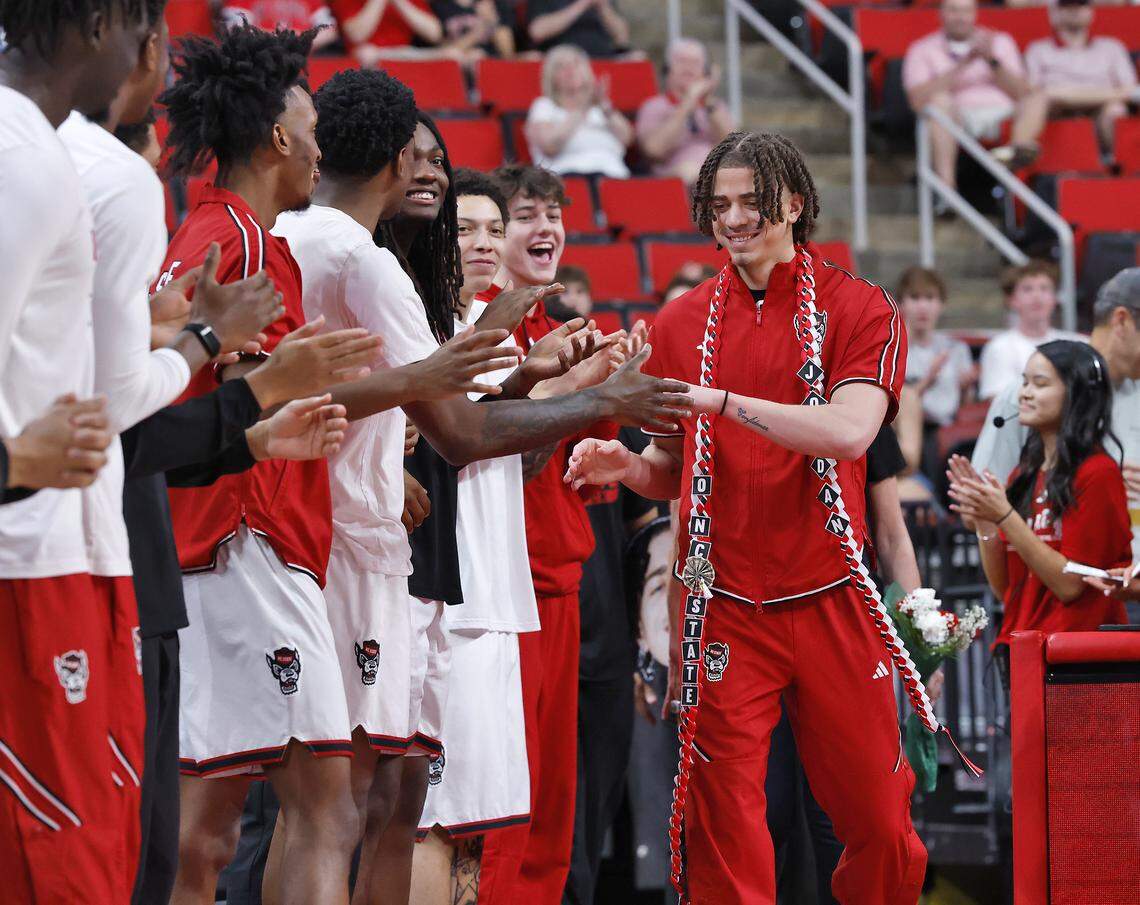 N.C. State’s Jordan Snell is greeted by teammates during a Senior Day ceremony prior to the Wolfpack’s game against Stanford on Saturday, March 7, 2026, at Lenovo Center in Raleigh, N.C. 