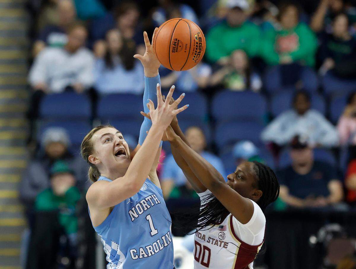 North Carolina’s Alyssa Ustby strips the ball from Florida State’s Ta’Niya Latson during the first half of the Tar Heels’ ACC Tournament quarterfinal game on Friday, March 7, 2025, at First Horizon Coliseum in Greensboro, N.C.