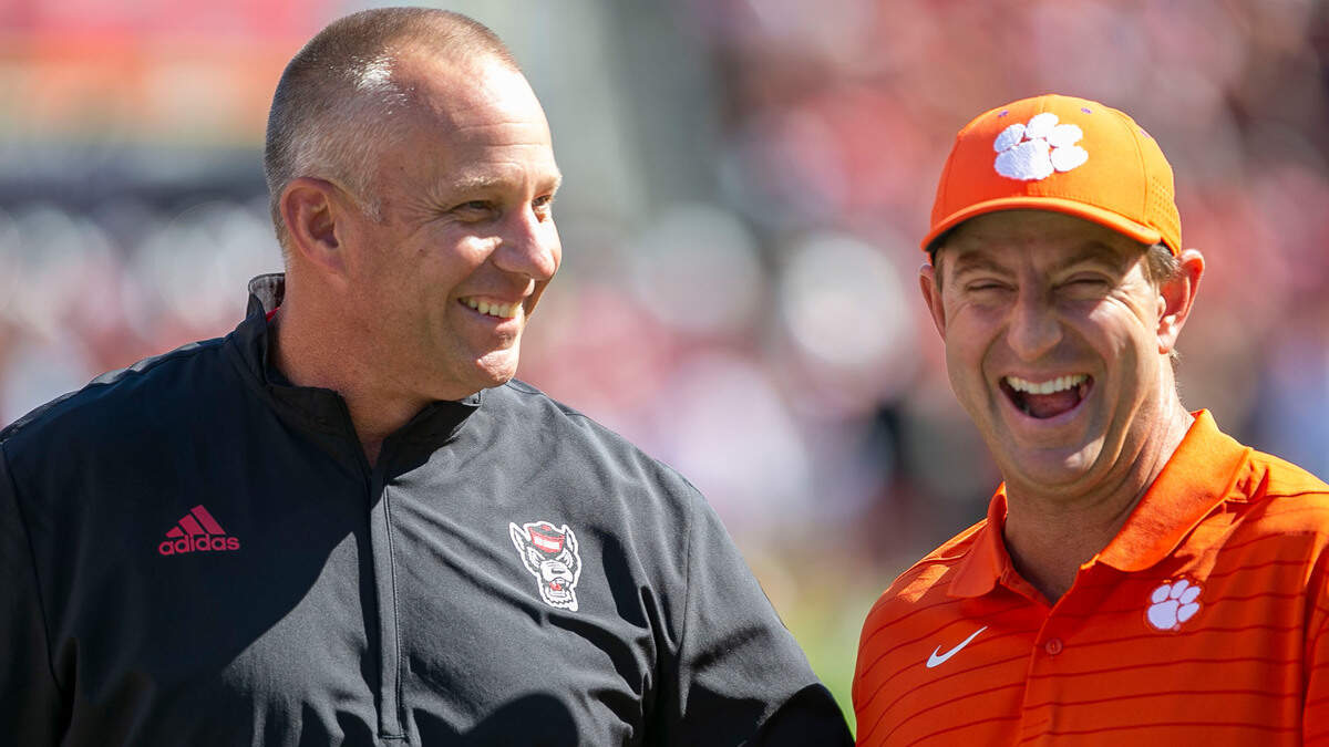 Clemson coach Dabo Swinney laughs with N.C. State coach Dave Doeren prior to their game on Saturday September 25, 2021 at Carter-Finley Stadium in Raleigh, N.C.