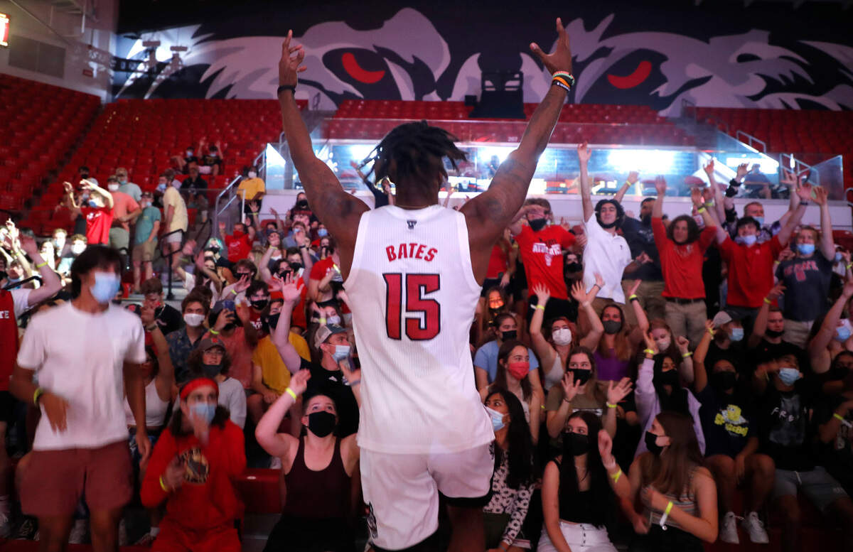 N.C. State’s Manny Bates (15) dances with the fans during Primetime with the Pack at Reynolds Coliseum in Raleigh, N.C., Thursday, October 14, 2021.