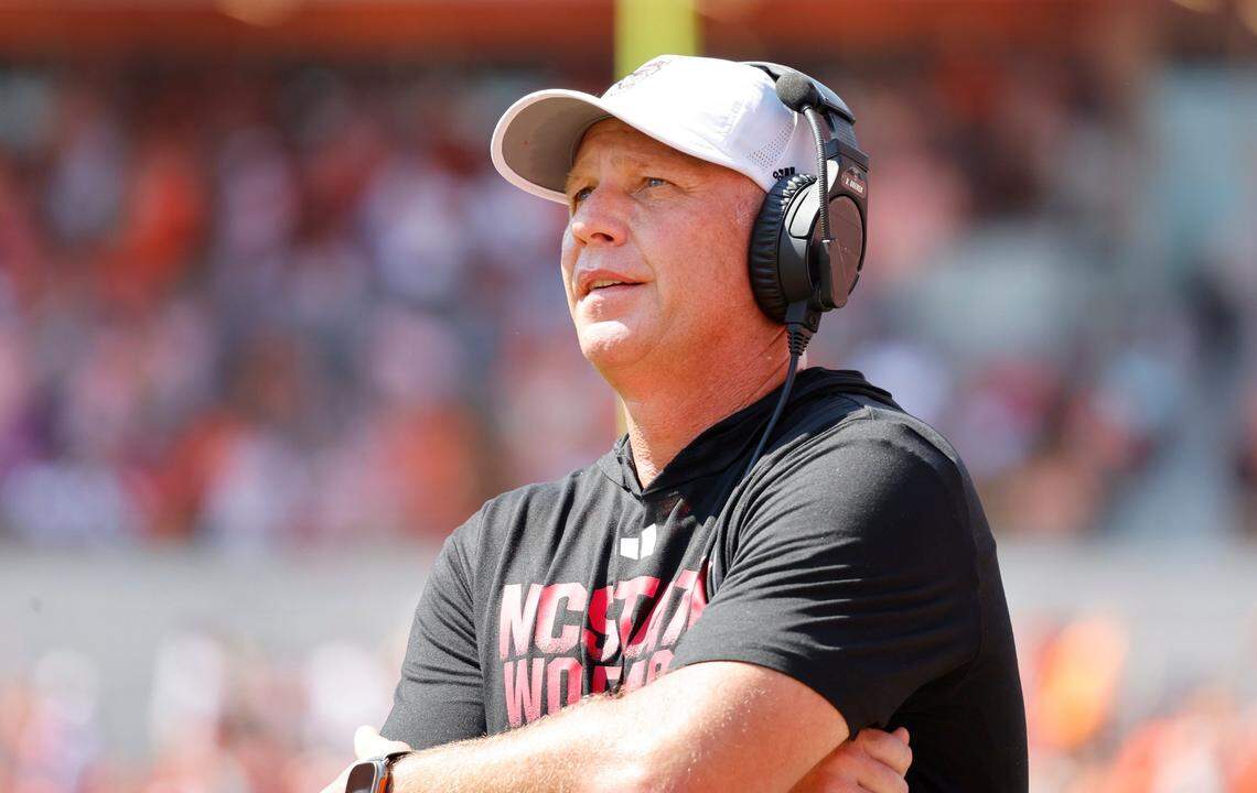 N.C. State head coach Dave Doeren looks up at the scoreboard after Clemson scored during the first half of N.C. State’s game against Clemson at Memorial Stadium in Clemson, S.C., Saturday, Sept. 21, 2024.