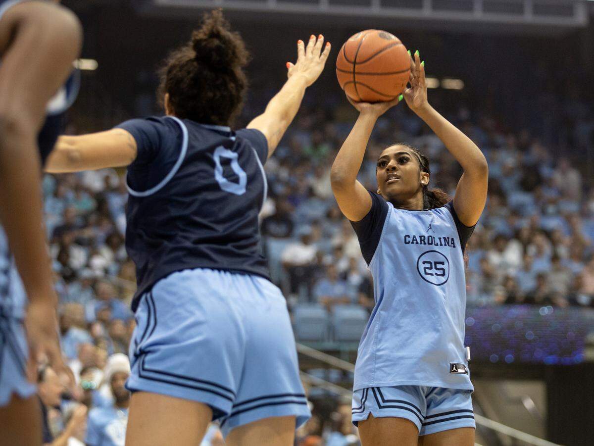 Deja Kelly shoots over Alexandra Zelaya during a scrimmage at “Live Action with Carolina Basketball” at the Dean E. Smith Center on Friday, Oct. 7, 2022, in Chapel Hill, N.C.