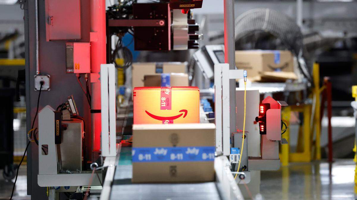 Packages are scanned at RDU1, an Amazon Robotics Fulfillment Center in Garner on July 1.