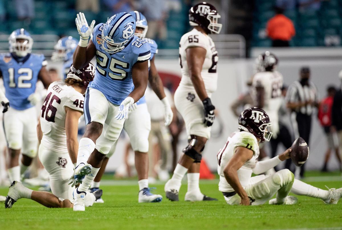 North Carolina’s Kaimon Rucker (25) celebrates after a sack of Texas A&M quarterback Kellen Mond (11) in the second quarter of the Capital One Orange Bowl on Saturday, January 2, 2021in Miami Gardens, Florida.