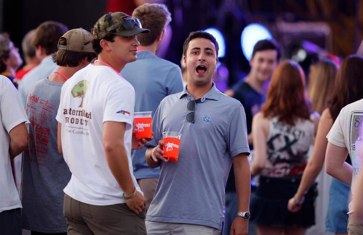 Attendees enjoy the music at “Flagstock 2024,” an invite-only concert event featuring country musicians Big & Rich and Lee Greenwood, among others, at a location in Chapel Hill, N.C., Monday, Sept. 2, 2024. Flagstock started after a GoFundMe raised over $500,000 for a “rager” for UNC-Chapel Hill fraternity brothers who held up the American flag during an April campus protest.