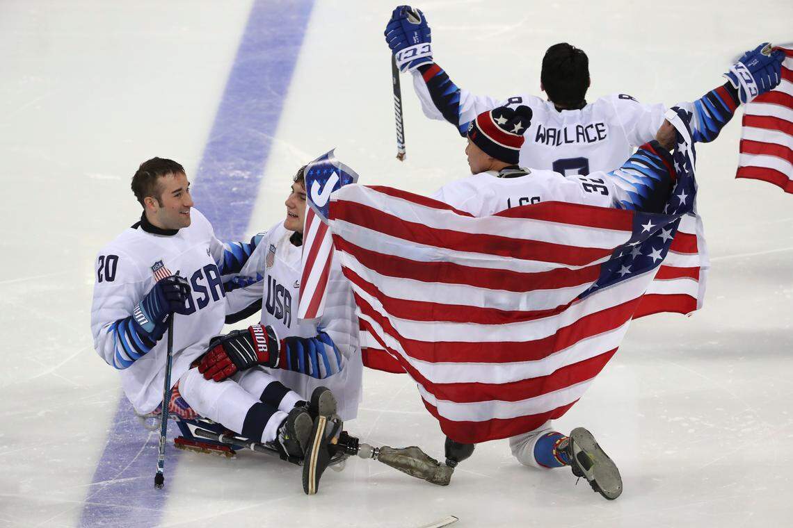 From left, United States’ Adam Page, Brody Roybal, Jen Lee and Jack Wallace celebrate after defeating Canada in the Ice Hockey gold medal match for the 2018 Winter Paralympics at the Gangneung Hockey Center in Gangneung, South Korea, Sunday, March 18, 2018. (AP Photo/Ng Han Guan)