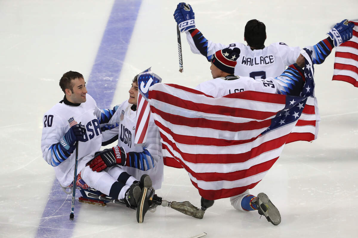 From left, United States’ Adam Page, Brody Roybal, Jen Lee and Jack Wallace celebrate after defeating Canada in the Ice Hockey gold medal match for the 2018 Winter Paralympics at the Gangneung Hockey Center in Gangneung, South Korea, Sunday, March 18, 2018. (AP Photo/Ng Han Guan)
