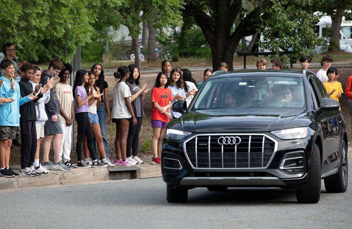 Hundreds of Davis Drive Middle School students cheer as seventh-grader Ananya Rao Prassanna and her family arrive at the school on Monday, June 3, 2024, in Cary, N.C. Prassanna placed third in the Scripps National Spelling Bee.