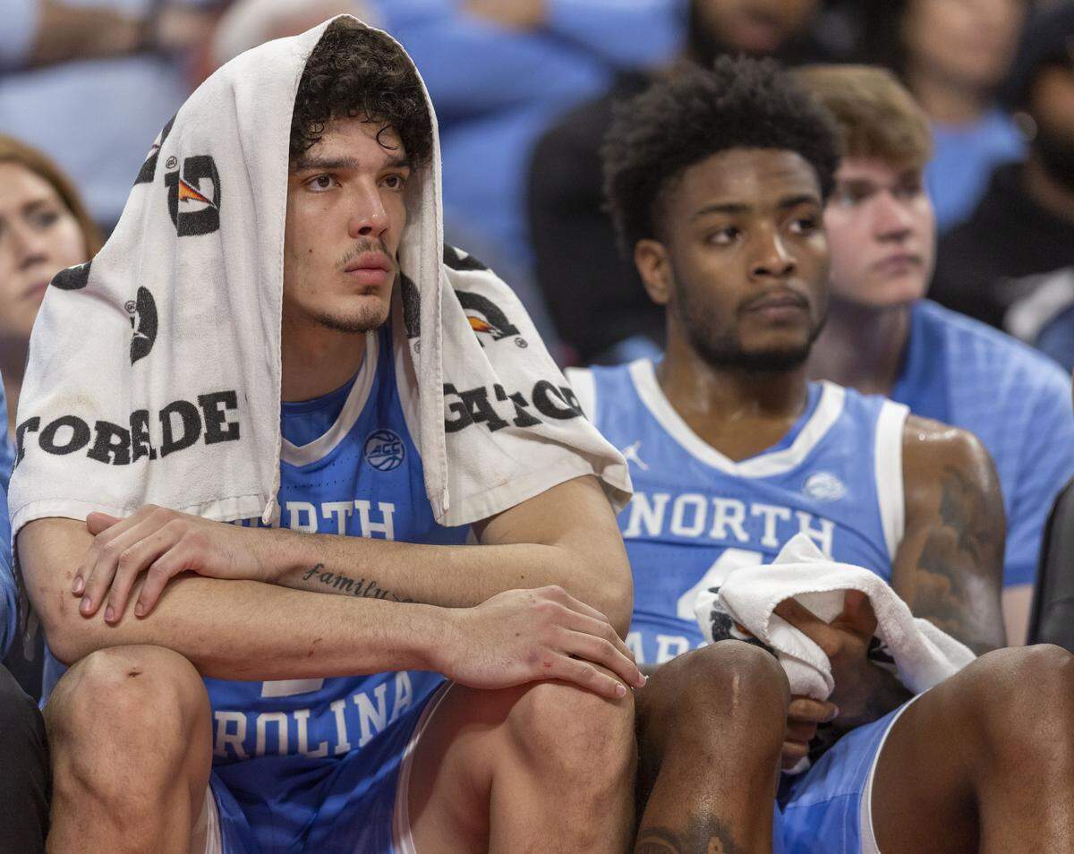North Carolina center Zayden High (1) and guard Jaydon Young (4) watch the closing minute of play from the bench as the Wolfpack rolls to an 82-58 victory on Tuesday, February 17, 2026 at Lenovo Center in Raleigh, N.C