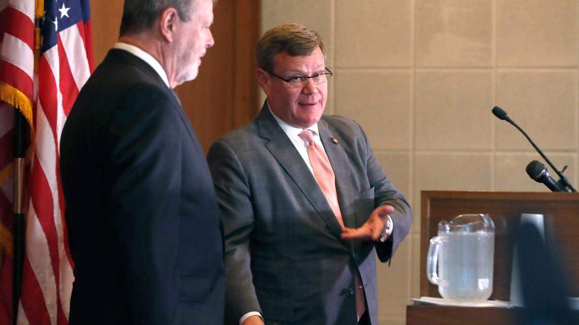N.C. Senate leader Phil Berger, left, and House Speaker Tim Moore talk during a press conference on the first day of a brief session Wednesday, Sept. 2, 2020.