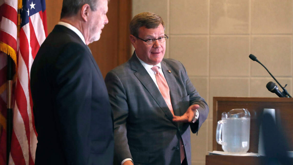 N.C. Senate leader Phil Berger, left, and House Speaker Tim Moore talk during a press conference on the first day of a brief session Wednesday, Sept. 2, 2020.