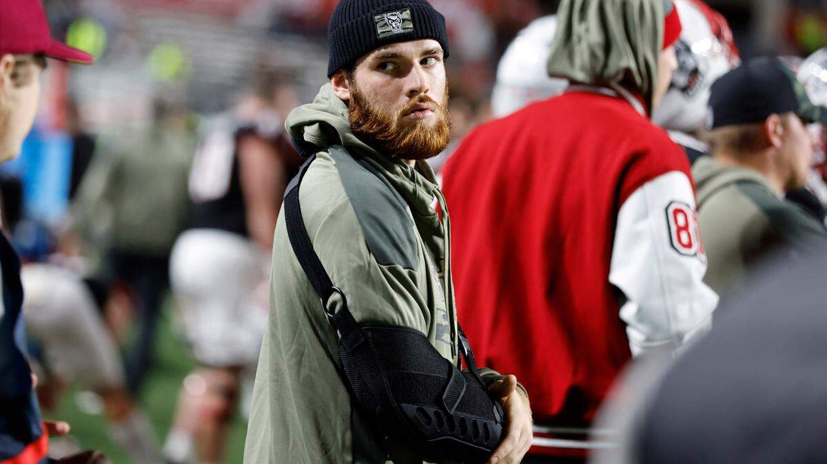 N.C. State quarterback Devin Leary stands on the sidelines during the second half of N.C. State’s 22-21 victory over Virginia Tech at Carter-Finley Stadium in Raleigh, N.C., Thursday, Oct. 27, 2022.