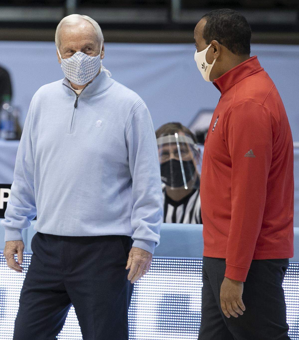 North Carolina coach Roy Williams chats with N.C. State coach Kevin Keatts prior to their game on Saturday, January 23, 2021 at the Smith Center in Chapel Hill, NC.