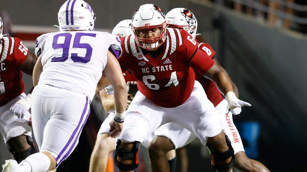N.C. State offensive lineman Chandler Zavala (64) prepares to block Furman defensive tackle Parker Stokes (95) during the Wolfpack’s game against Furman at Carter-Finley Stadium in Raleigh, N.C., Saturday, Sept 18, 2021.