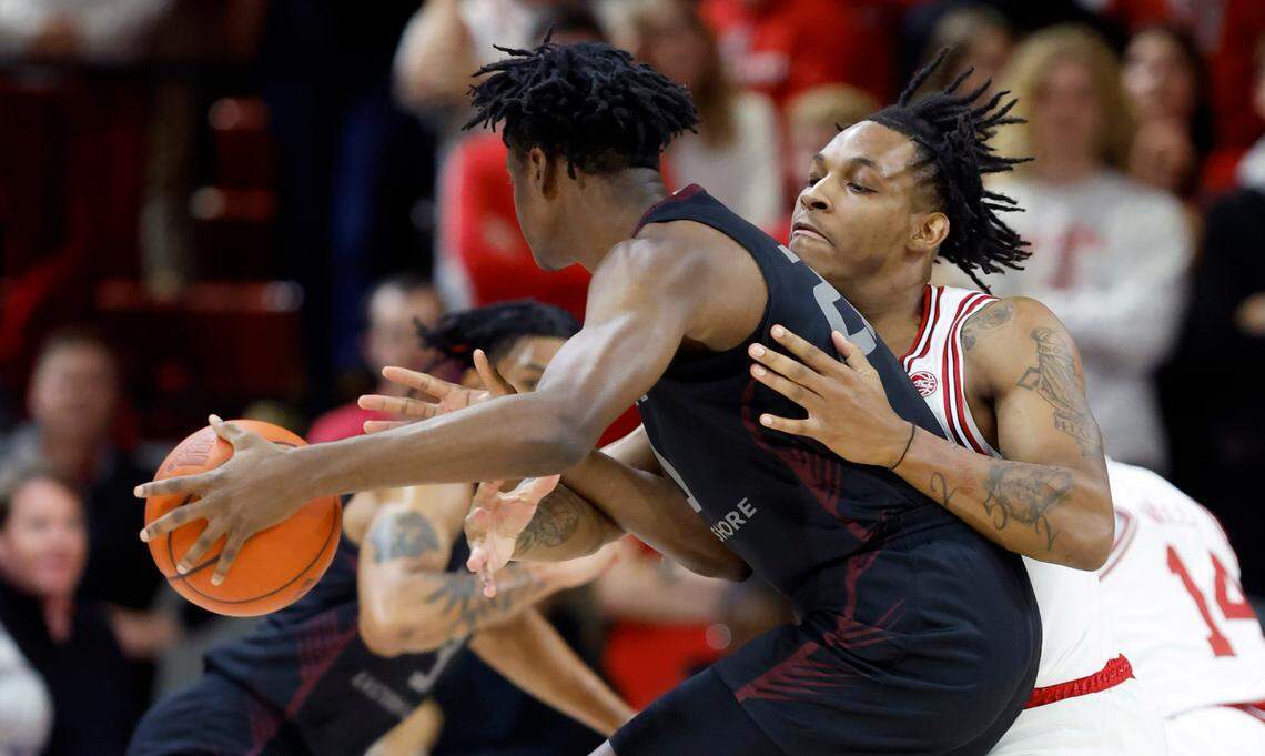 N.C. State’s MJ Rice (3) defends Maryland Eastern Shore’s Israel Yaw (20) during the first half of N.C. State’s game against Maryland Eastern Shore at Reynolds Coliseum in Raleigh, N.C., Wednesday, Dec. 6, 2023.