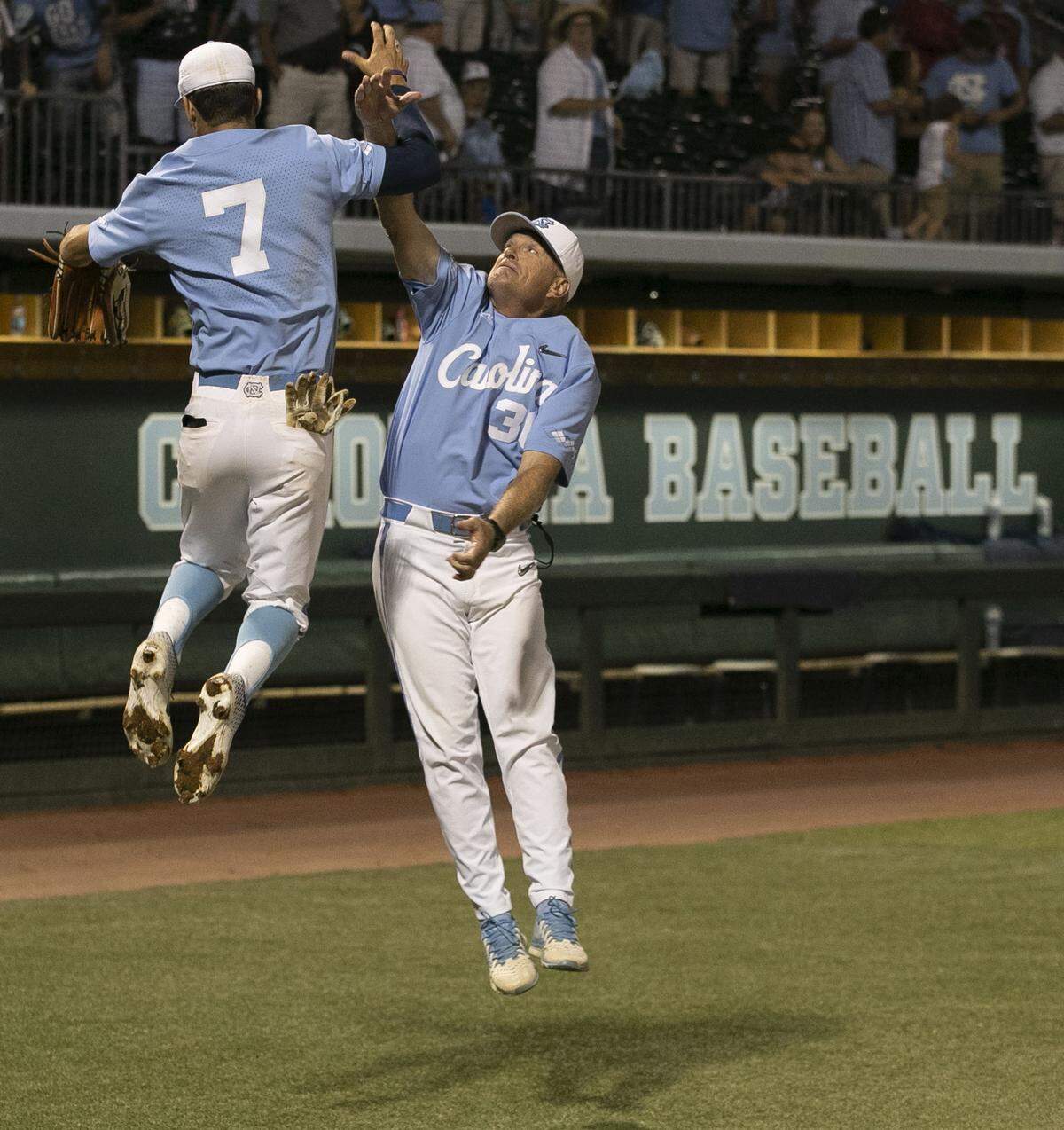 North Carolina coach Mike Fox celebrates the Tar Heels’ 5-2 victory over Tennessee with Dallas Tessar on Sunday June 2, 2019 at Boshamer Stadium in Chapel Hill, N.C. The victory secured the NCAA regional championship for the Tar Heels.