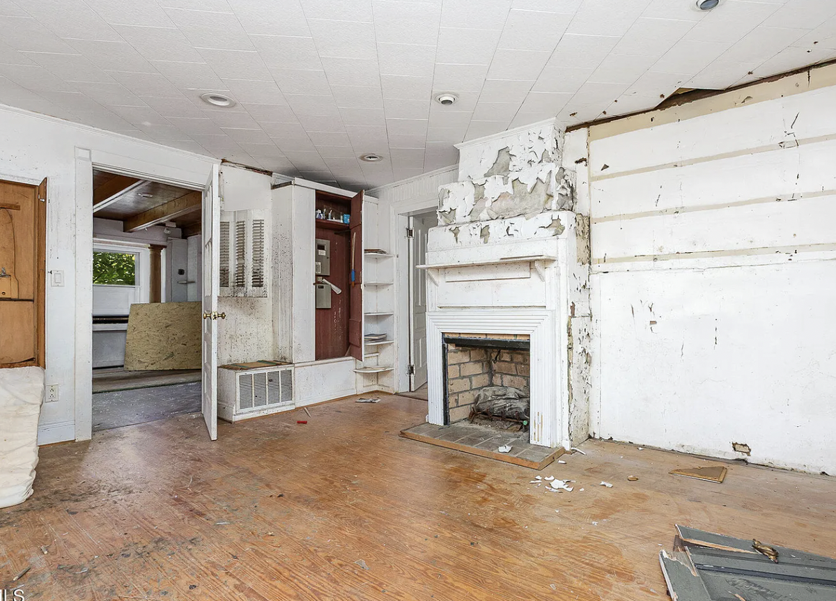 A photo of the living room at 421 Grigsby Ave. in Holly Springs, which has sat abandoned and neglected for years.