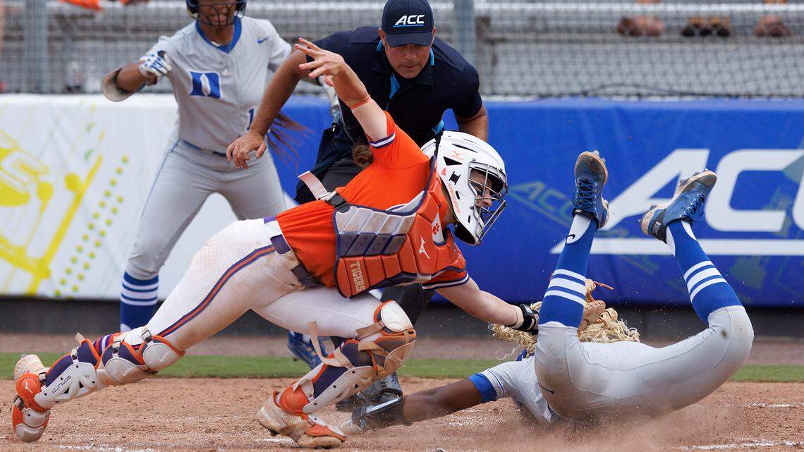 Duke’s Amiah Burgess slides into home plate under the tag of Clemson’s Aby Vieira to give the Blue Devils’ 4-3 victory in the tenth inning of the ACC Tournament semifinal game on Friday, May 10, 2024, in Durham, N.C.