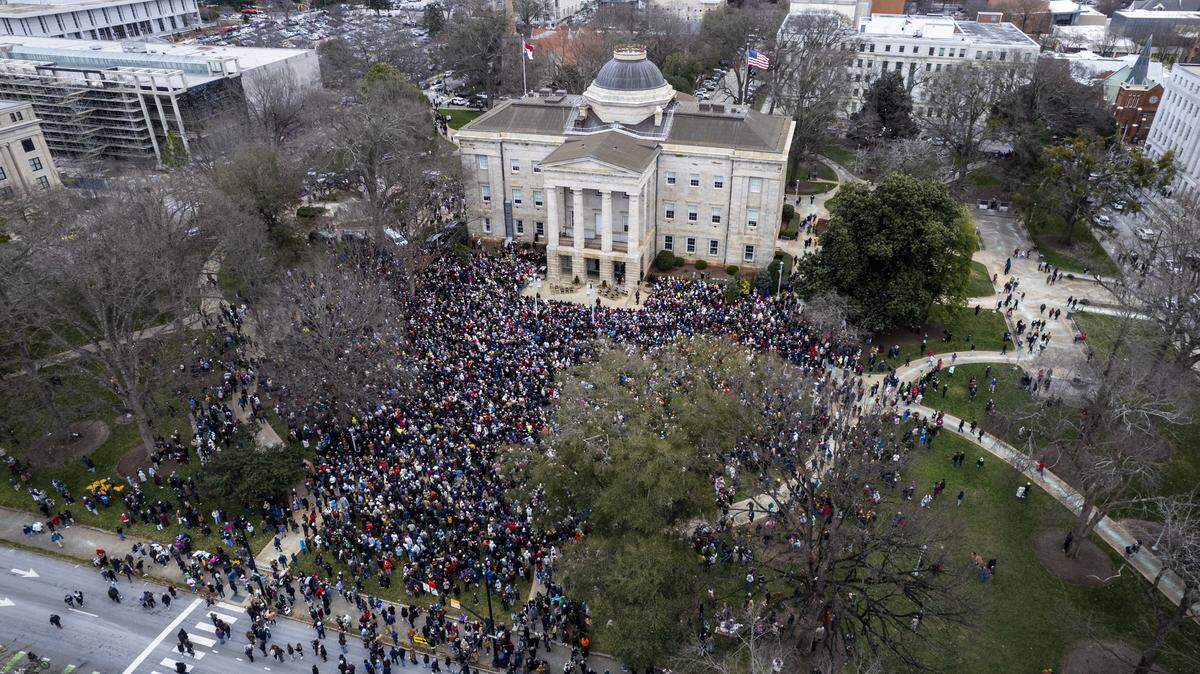 Hundreds gather at the North Carolina State Capitol to hear Buddhist monks speak on Saturday, Jan. 24, 2026. The monks are making a 2,300-mile pilgrimage from Texas to Washington, D.C., as part of the Walk for Peace, an effort to promote peace, compassion and national unity.