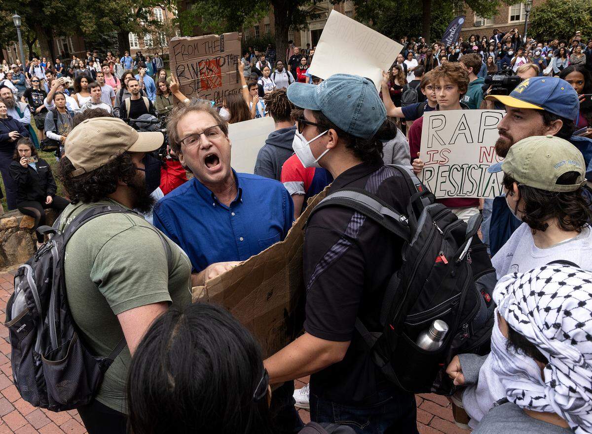 Pro-Palestinian demonstrators and counter-protesters interact during a rally in support of Palestinians at UNC-Chapel Hill on Thursday, Oct. 12, 2023. The rally was organized by the UNC chapter of Students for Justice in Palestine.