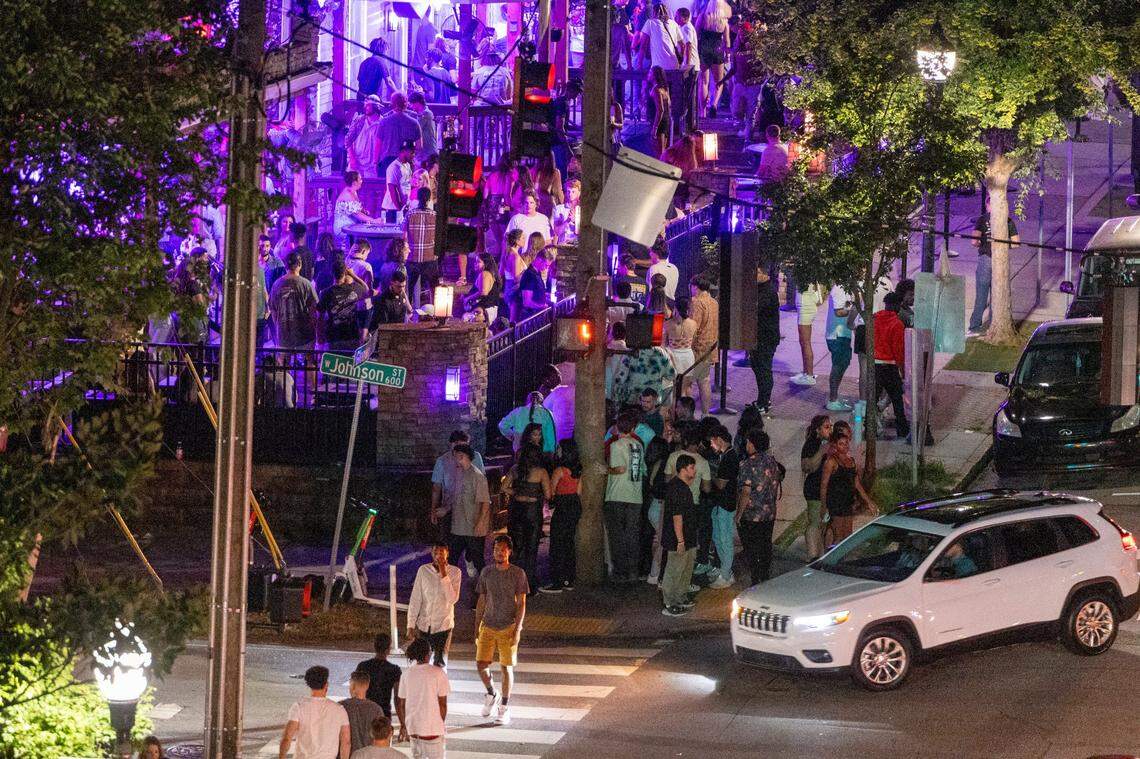 Glenwood Avenue and Cornerstone Tavern bustle with club-goers before 1 a.m. in the Glenwood South district on Friday, July 21, 2023.