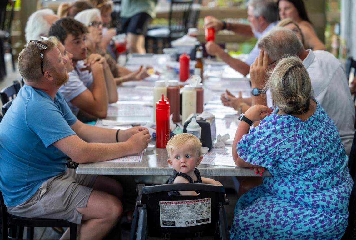Fifteen-month-old Maverick Thompson of Greenwood, S.C. enjoys his first visit to Captain Nance’s Seafood with his family on Friday, June 28, 2024 in Calabash, N.C.