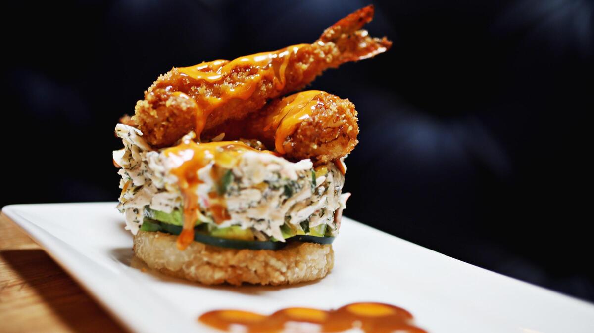 Scratch Kitchen & Taproom’s California Round is a play on a sushi roll reimagined as a molded cylinder of â€œkrabâ€ salad in spicy mayo atop a crispy rice cake, capped with a couple of tempura shrimp,