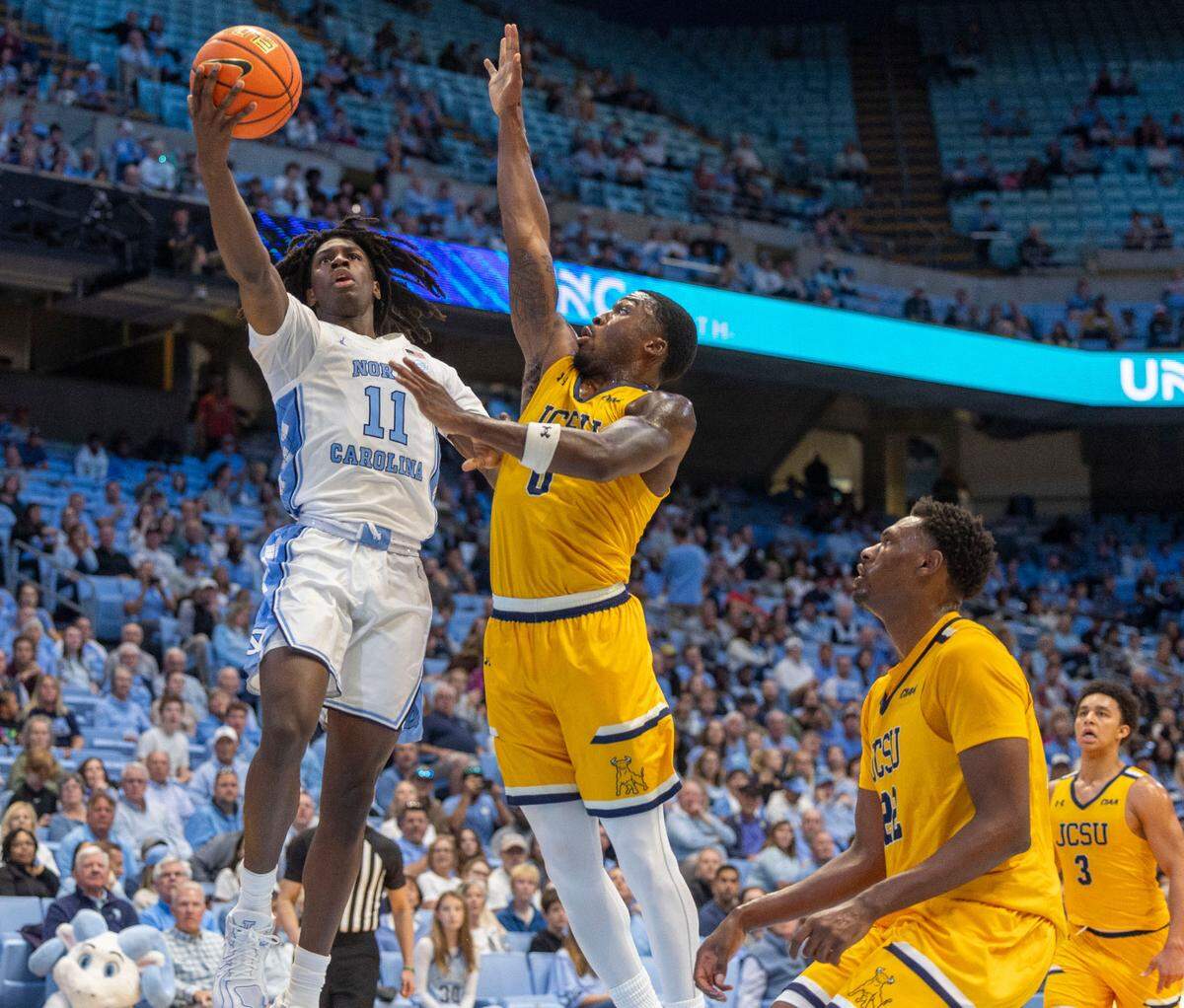 North Carolina guard Ian Jackson (11) drives to the basket against Johnson C. Smith’s Javon Anderson (0) during the first half on Sunday, October 27, 2024 at the Smith Center in Chapel Hill, N.C. Jackson lead all scores with 21 points in the Tar Heels’ 127-63 victory.