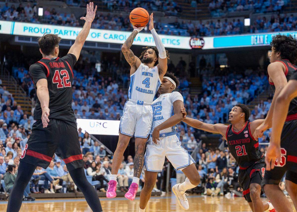North Carolina guard R.J. Davis (4) puts up a shot against Stanford’s Maxime Raynaud (42) in the first half on Saturday, January 18, 2025 at the Smith Center in Chapel Hill, N.C.