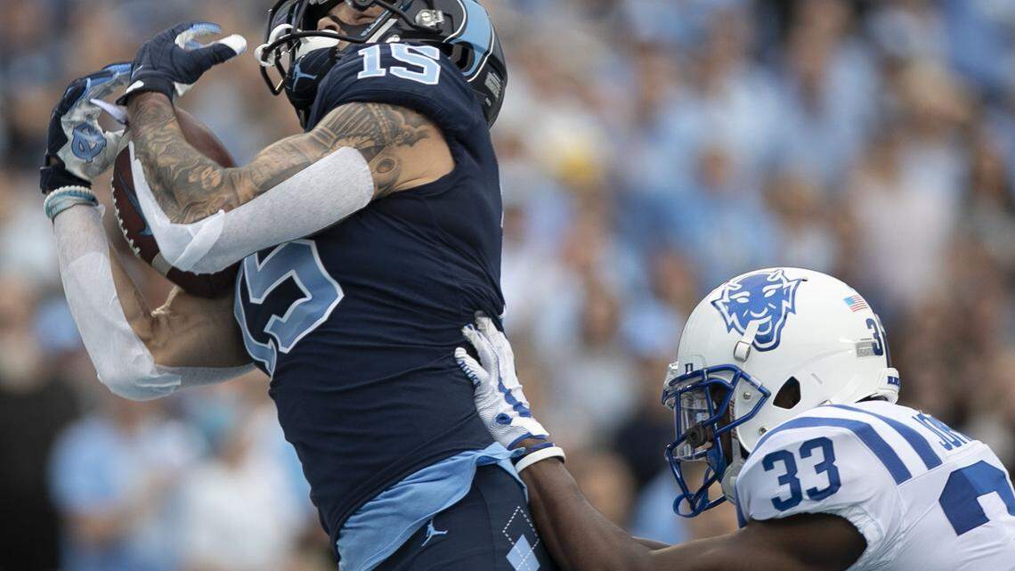 North Carolina’s Beau Corrales (15) scores on a 29-yard pass completion from quarterback Sam Howell ahead of Duke’s Leonard Johnson (33) in the first quarter on Saturday, October 26, 2019 at even Stadium in Chapel Hill, N.C.
