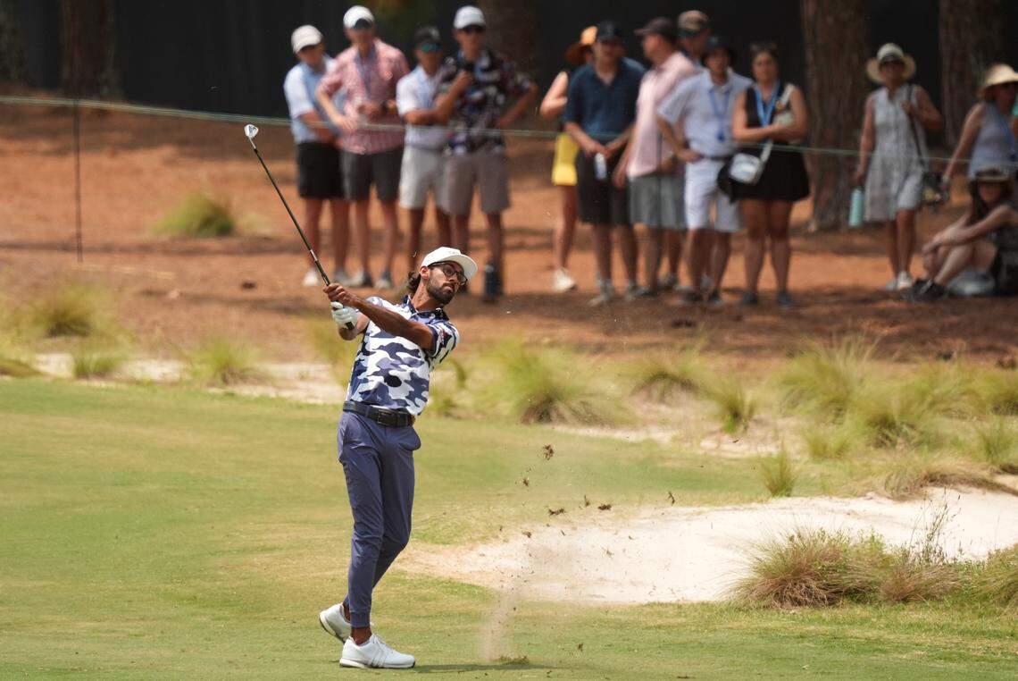 Jun 16, 2024; Pinehurst, North Carolina, USA; Akshay Bhatia hits from the first fairway during the final round of the U.S. Open golf tournament. Mandatory Credit: Katie Goodale-USA TODAY Sports