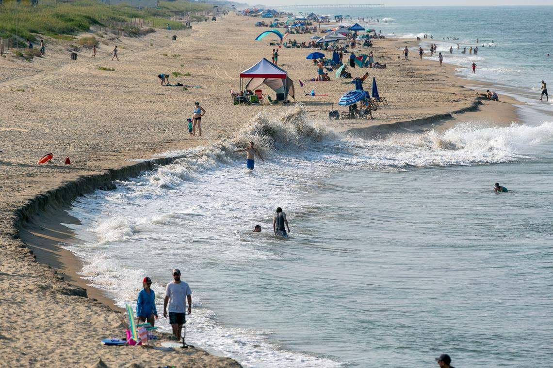 The beach erodes as the tides rises in an area north of Jennette’s Pier on Tuesday, July 20, 2021 in Nags Head, N.C.