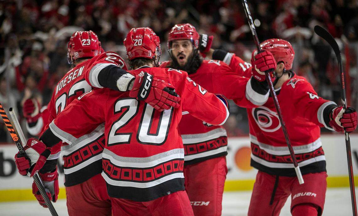 The Carolina Hurricanes Jalen Chatfield (5) celebrates with Sebastian Aho (20) after scoring on Florida Panthers goalie Sergei Bobrovsky (72) to take a 1-0 lead in the first period during Game 2 of the Eastern Conference Finals on Saturday, May 20, 2023 at PNC Arena in Raleigh, N.C.