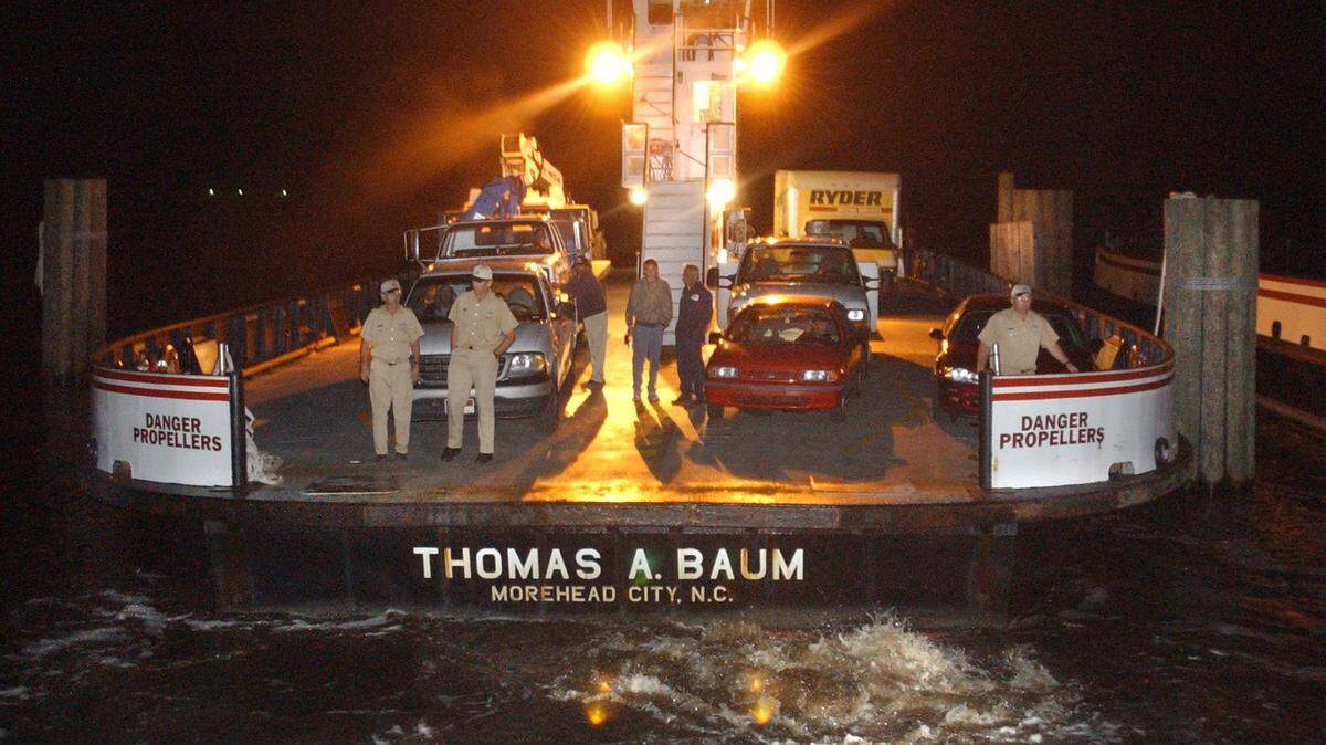 In this file photo from 2003, the ferry Thomas A. Baum docks at the ferry landing at Stumpy Point, N.C., with a load of cars and trucks from Hatteras Village. Residents were isolated after Hurricane Isabel devastated their village and cut a 1,000-foot inlet just north of town by taking out N.C. 12, cutting them off from the rest of the Outer Banks.