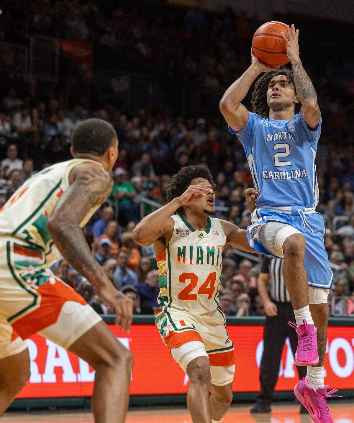 North Carolina’s Elliot Cadeau (2) puts up a shot against Nijel Pack (24) in the first half on Saturday, February 10, 2024 at the Watsco Center in Coral Gables, Florida.