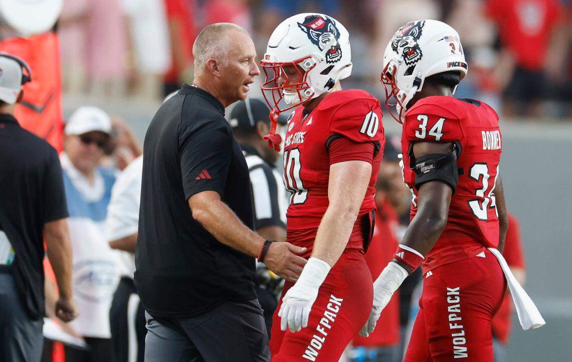 N.C. State head coach Dave Doeren talks with linebacker Caden Fordham (10) after Fordham was ejected for targeting during the first half of N.C. State’s game against Western Carolina at Carter-Finley Stadium in Raleigh, N.C., Thursday, August 29, 2024.