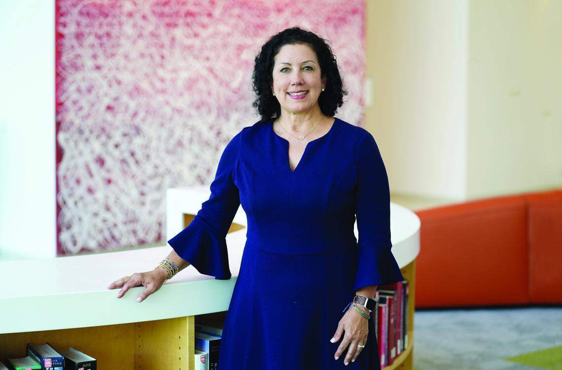 Melanie Shekita standing near a desk.