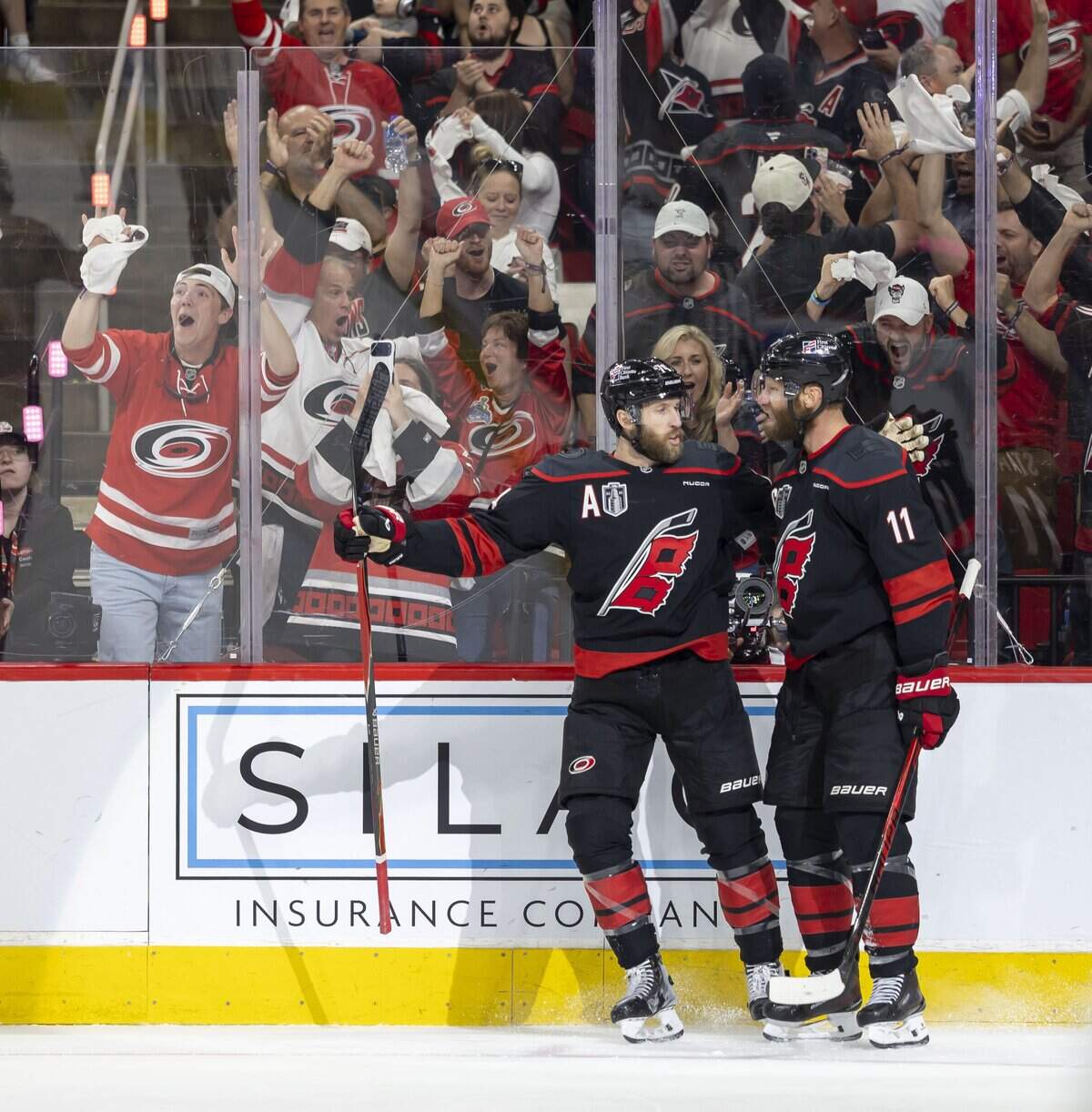 Carolina Hurricanes Carolina Hurricanes center Jordan Staal (11) celebrates with Jacoob Slavin (74) after scoring on Vegas goalie Carter Hart (79) to tie the score 1-1 in the first period in Game 5 of the Stanley Cup Final against Vegas, on Thursday, June 11, 2026 at Lenovo Center in Raleigh, N.C.