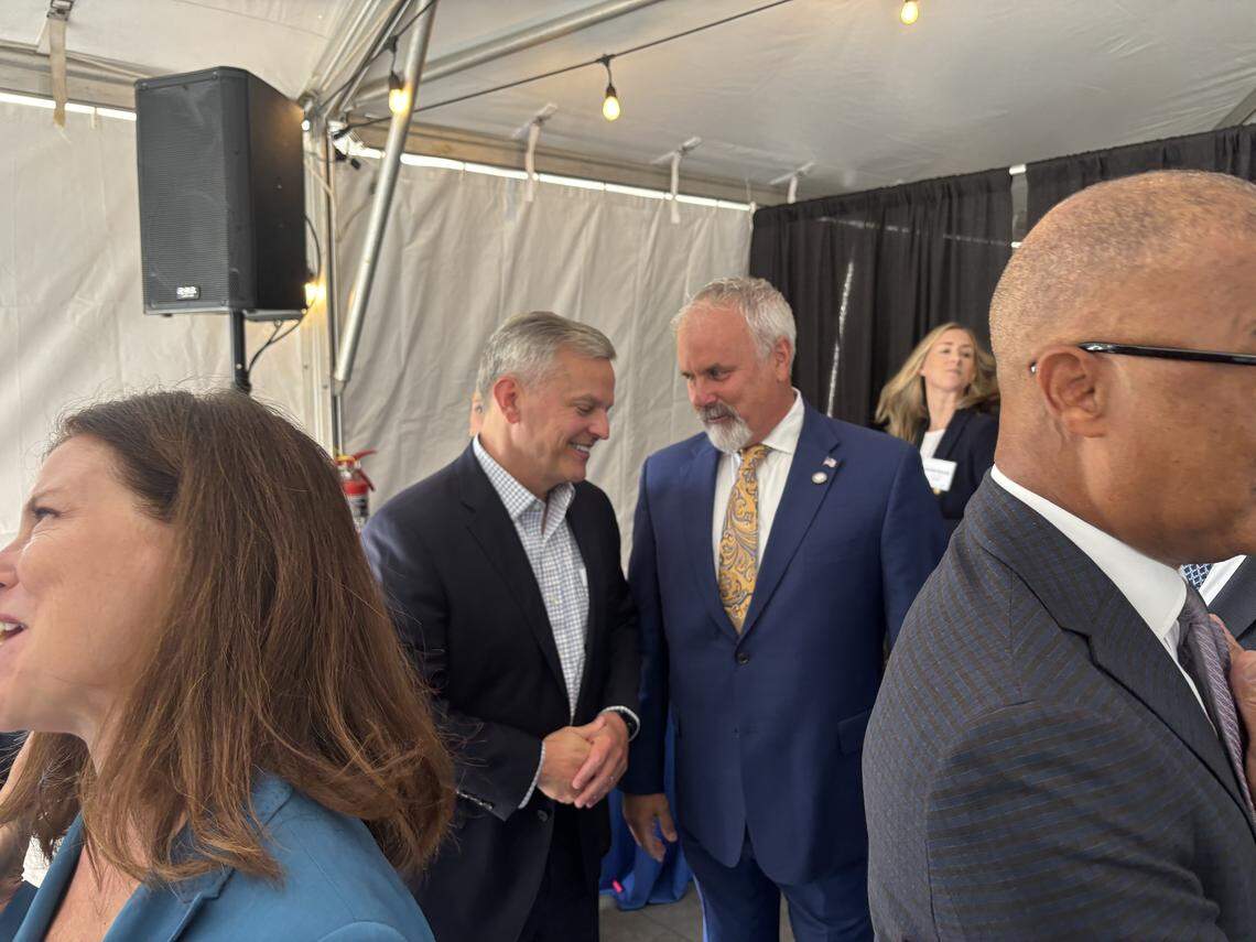 North Carolina Gov. Josh Stein (left) speaks with Holly Springs Mayor Sean Mayefskie (right) at the Genentech groundbreaking ceremony in Holly Springs, NC on Aug. 25, 2025.