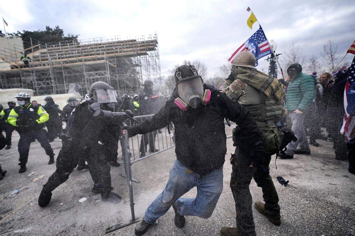 Trump supporters try to break through a police barrier, Wednesday, Jan. 6, 2021, at the Capitol in Washington. As Congress prepares to affirm President-elect Joe Biden’s victory, thousands of people have gathered to show their support for President Donald Trump and his claims of election fraud.