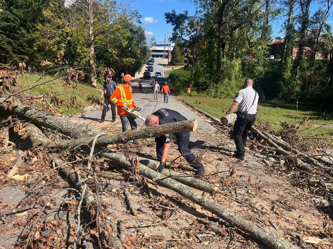 Officers from the Rolesville Police Department help with debris removal in Hendersonville in the aftermath of Hurricane Helene. The department sent five officers Sept. 29 to assist with recovery efforts.