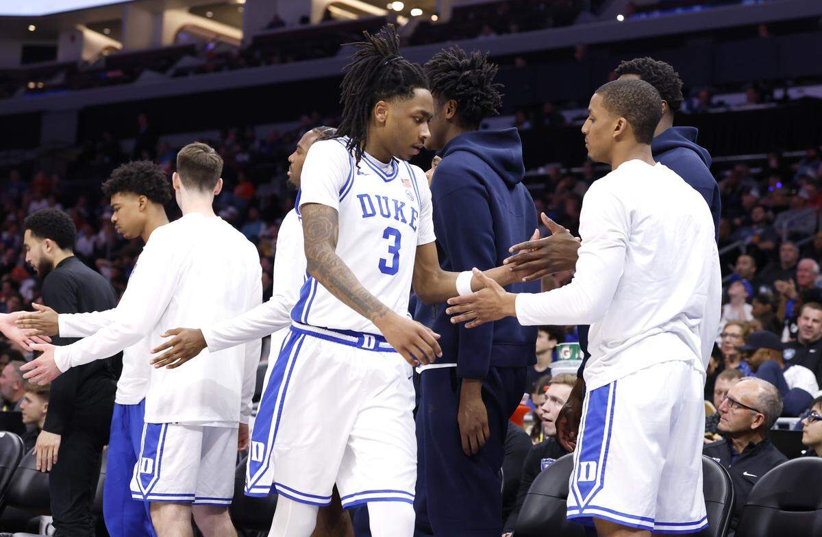 Duke’s Brock Davis, right, congratulates Isaiah Evans as he comes off the floor during the second half of Duke’s 73-61 victory over Clemson in the semifinals of the 2026 ACC Men’s Basketball Tournament at the Spectrum Center in Charlotte, N.C., Friday, March 13, 2026.