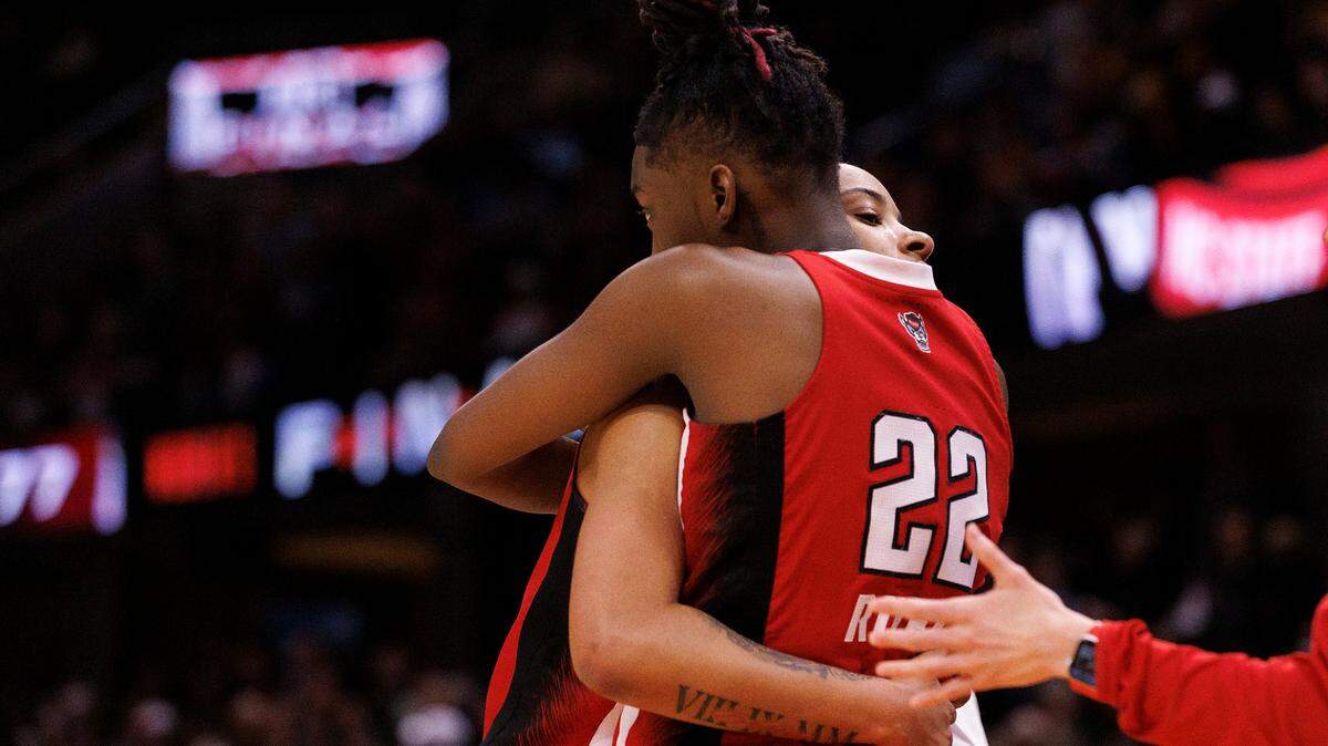 N.C. State’s Aziaha James and Saniya Rivers embrace in the closing minutes of the Wolfpack’s 78-59 Final Four loss to South Carolina at Rocket Mortgage FieldHouse on Friday, April 5, 2024, in Cleveland, Ohio.