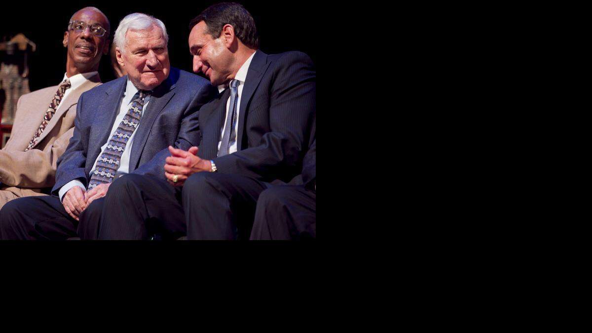 Duke coach Mike Krzyzewski acknowledges former UNC coach Dean Smith as he is honored with the Dr. James A. Naismith Good Sportsmanship Award on Wednesday June 29, 2011 at Memorial Auditorium in Raleigh, N.C. 
