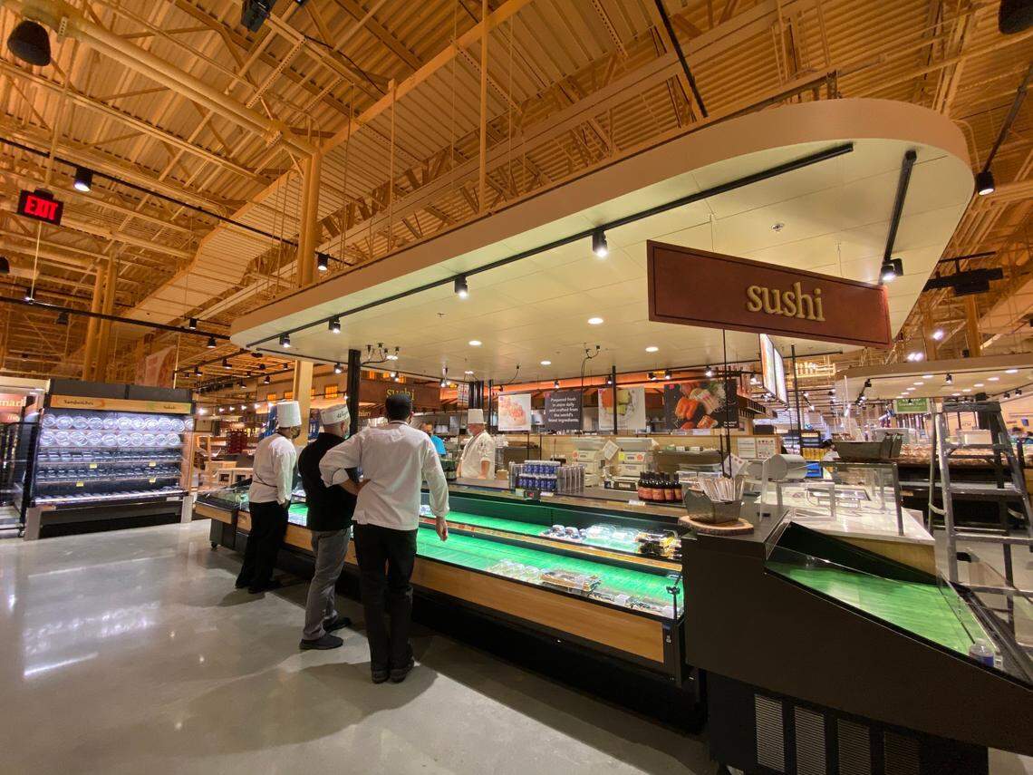 Employees work on July 27, 2020, to ready the Wegmans grocery store in West Cary for its grand opening on July 29, 2020.
