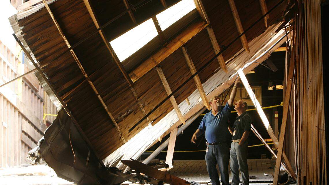 City of Durham officials inspect a collapsed roof section in the center of the Liberty Warehouse on Foster St., Durham Monday May 16, 2011 after weekend rains led to the collapse of a  roof section flooding businesses in the center of the warehouse. Inspectors and business owners toured the damaged warehouse while others started moving out of their flooded businesses.